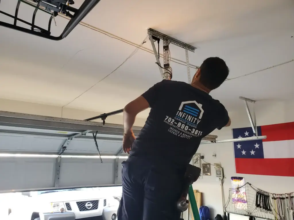 Infinity Garage Door technicians repairing a garage door in Spring Valley, NV